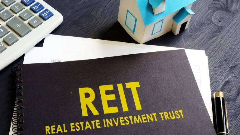 Illustration of Malaysian REIT buildings and tax documents
